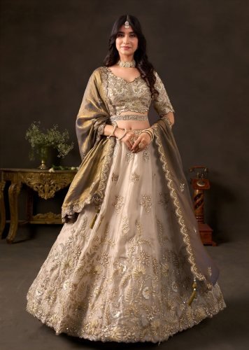 Luxurious Fendy Silk With Multiple Sequence Embroidery And Dori Work Bridal Lehenga Choli Beige Gold Color DN 106019