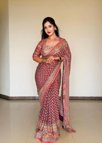 Trending Stylish Designer DN 5571 Premium Soft Chinnon With Beautiful Print And Handcrafted Real Mirror Work Orange Color