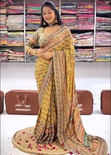 Trending Stylish Designer DN 5571 Premium Soft Chinnon With Beautiful Print And Handcrafted Real Mirror Work Yellow Color